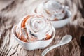 Delicious homemade sweet buns with cinnamon and icing sugar Christmas at the old wooden table. Traditional Swedish pastries, Royalty Free Stock Photo