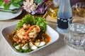 Delicious homemade Thai winged bean salad or sour and spicy thai herb salad with shrimp and boiled egg. Wing Bean Salad with Prawn