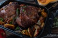 Thanksgiving meat dish with roast turkey shanks. Served with roasted butternut squash, onions and apples in a roasting pan. Royalty Free Stock Photo