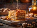 Delicious Honey Drizzling on a Stack of Golden Pancakes with Nuts and Cinnamon on Rustic Wooden Table Royalty Free Stock Photo