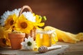 Delicious honey and fresh pollen of flowers on a wooden table. Selective focus.