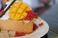 Delicious honey toast bread with ice cream and mango Royalty Free Stock Photo