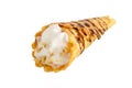 Delicious honeyed waffles, twisted into cones with cream, nuts, chocolate topping isolated