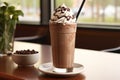 Delicious hot chocolate milkshake with creamy whipped cream topping in a stylish glass