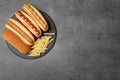 Delicious hot dogs and french fries on grey background Royalty Free Stock Photo