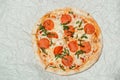 Delicious hot fresh Pepperoni pizza with mozzarella cheese and salami. On light paper background Royalty Free Stock Photo