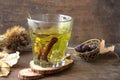 Delicious Hot herbal tea:linden, dog rose, mint, cinnamon. Hot Tea being poured into a glass Royalty Free Stock Photo