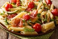 Delicious hot penne pasta with ham, cherry tomatoes, zucchini an Royalty Free Stock Photo