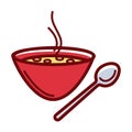 Delicious hot soup in deep red bowl with metal spoon