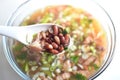 Delicious hot and spicy pork meat along with red beans in the soup