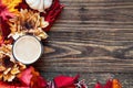 Hot Cup of Steaming Coffee with Autumn Leaves and Flowers Royalty Free Stock Photo