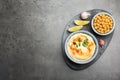 Delicious hummus with paprika and chickpeas served on dark grey table, flat lay. Space for text Royalty Free Stock Photo