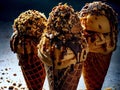 Delicious ice cream cones with toppings and sprinkles