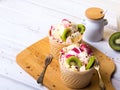 Delicious ice cream in a cup and tasty fruits Royalty Free Stock Photo