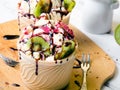 Delicious ice cream in a cup with tasty fruits Royalty Free Stock Photo