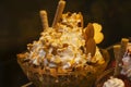 Delicious  ice cream with fruits, chocolate, nuts in glass bowl. Close up Royalty Free Stock Photo