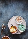 Delicious ice cream sundaes in different  pastel colored bowls Royalty Free Stock Photo