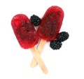 Delicious ice pops and fresh blackberries on white background, top view. Fruit popsicle Royalty Free Stock Photo