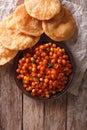 Delicious Indian Chana masala and puri. Vertical top view