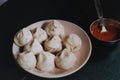 A delicious Indian delicacy named Momo, can be roasted or cooked, the dough is made with wheat flour and water, stuffed with