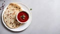 Delicious Indian Paratha Bread with Red Sauce on Plate, Copy Space