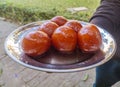 A delicious indian sweet named GulabJaamun.