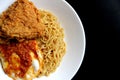 Delicious Instant Noodle with Crispy Chicken and Fried Egg Royalty Free Stock Photo