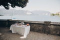 Delicious italian appetizers on table at wedding reception outdoors. Canapes and champagne, fruits on table at sea shore in Italy Royalty Free Stock Photo