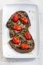 Delicious Italian bruschetta with toasted bread and with cherry tomatoes, basil and garlic Royalty Free Stock Photo