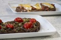 Delicious Italian bruschetta with toasted bread and with cherry tomatoes, basil and garlic and toasted bread with fresh cheese, Royalty Free Stock Photo