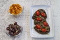 Delicious Italian bruschetta with toasted bread and with cherry tomatoes, basil and garlic  black greek olives and Royalty Free Stock Photo