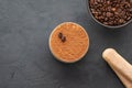 Delicious Italian dessert tiramisu, chocolate, cocoa and coffee beans on a black background. Top view with copy space. Royalty Free Stock Photo