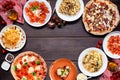 Delicious Italian food frame on a dark wood background Royalty Free Stock Photo