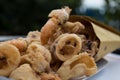 Delicious italian fritto misto, fried fish, served in a paper cone; kiosk and street food Royalty Free Stock Photo