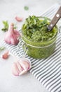 Delicious Italian green pesto sauce in a jar.