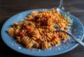 Fusilli pasta with tomato sauce and parmesan cheese, selective focus Royalty Free Stock Photo