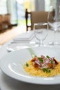 Delicious italian pasta dish served on a white cloth table in a fancy restaurant