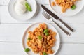 Pasta with tomato and mozzarella on a plate. Flat lay on white background Royalty Free Stock Photo