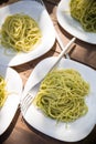 Delicious Italian pasta with green pesto. Spaghetti with homemade basil pesto sauce. Healthy dinner or lunch. Homemade Royalty Free Stock Photo