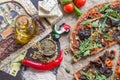 Delicious italian pizza and additions on wooden table Royalty Free Stock Photo