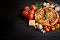Delicious italian pizza served on black wooden table Royalty Free Stock Photo
