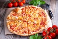 Delicious italian pizzas served on wooden table Royalty Free Stock Photo