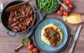 Pork stew with creamy polenta and green beans. Delicious gluten free sunday or holiday meat dish Royalty Free Stock Photo
