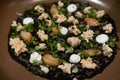 Delicious Italian risotto with cuttlefish ink or squid-ink with cauliflower. Black risotto. Healthy gourmet food.