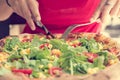 Delicious italian styled vegetable pizza with tomatoes, corn and rucola.