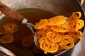 Delicious jalebi frying in oil pan