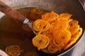 Delicious jalebi frying in oil pan