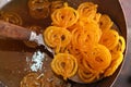 Delicious jalebi frying in oil pan