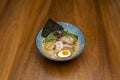 Delicious Japanese miso ramen with boiled egg, pork fillets, shiitake mushrooms,