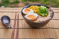 Delicious japanese shoyu ramen soup served outside in traditional bowl. Royalty Free Stock Photo